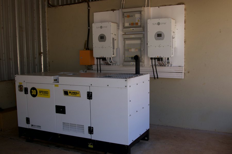 Standby generator installed beside a home's electrical equipment